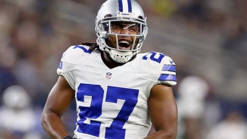 ARLINGTON, TX - DECEMBER 19:   J.J. Wilcox #27 of the Dallas Cowboys reacts against the New York Jets in the first half at AT&T Stadium on December 19, 2015 in Arlington, Texas.  (Photo by Tom Pennington/Getty Images)