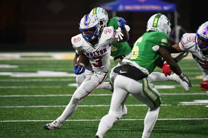 Makari Bodiford, a running back for Walton, breaks free during a 42-35 road win over Buford in the second round of the state playoffs on Friday night. (Jamie Spaar for the Atlanta Journal Constitution)