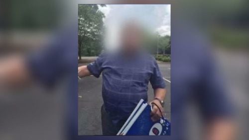A man was photographed allegedly stealing campaign signs in Fulton County. (Credit: Channel 2 Action News)