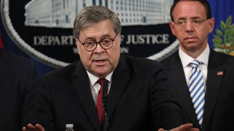 U.S. Attorney General William Barr speaks during a press conference on the release of the redacted version of the Mueller report at the Department of Justice April 18, 2019 in Washington. Also pictured is Deputy Attorney General Rod Rosenstein.