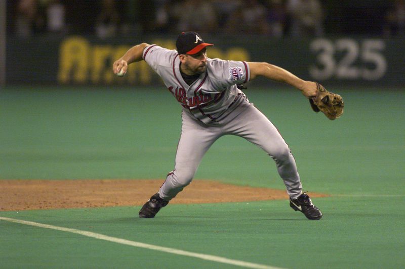 Braves' infielder Walt Weiss fires the ball to the plate and catcher Eddie Perez to save a potential game winning run from scoring in the form of Ken Caminiti in 10th inning of Game 3 of the NLDS Friday, Oct. 8, 1999, at the Astrodome in Houston. (FRANK NIEMEIR/AJC file)