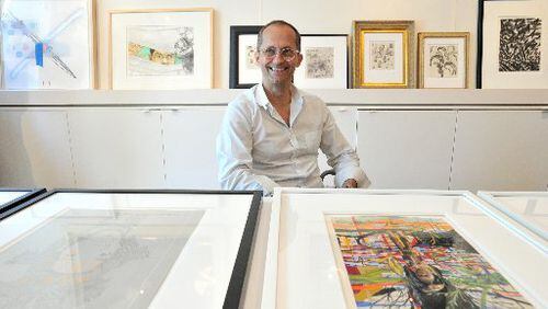 High Museum curator of modern and contemporary art Michael Rooks with works from "Drawing Inside the Perimeter," a major 2013 exhibit that featured pieces by more than 40 metro artists. HYOSUB SHIN / HSHIN@AJC.COM