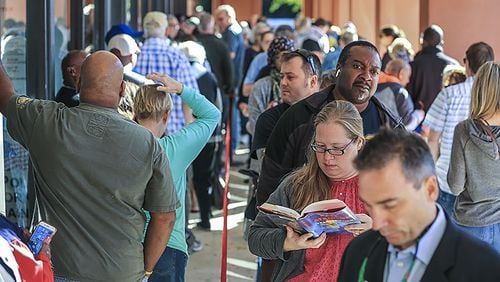 People lined up Thursday Oct. 18, 2018 at the Cobb County West Park Government Center in Marietta.