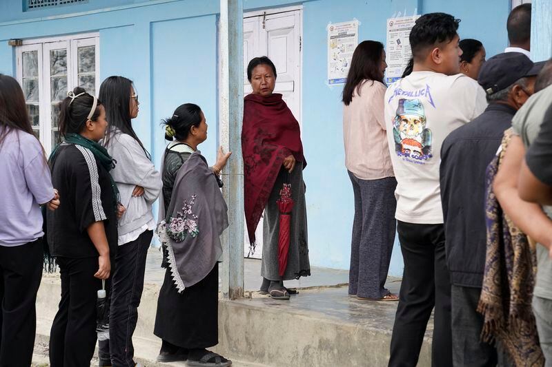 People wait in a queue to cast their votes during the first round of polling of India’s national election in Chedema village, in the northeastern Indian state of Nagaland, Friday, April 19, 2024. (AP Photo/Yirmiyan Arthur)