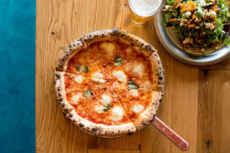 Ammazza Decatur Margherita Pizza with house tomato sauce, house mozzarella, fresh basil, and extra virgin olive oil. Photo credit- Mia Yakel.