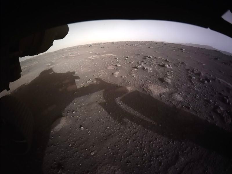 An image provided by NASA, taken on Feb. 18, shows the view from the Perseverance rover, without a protective cap over the camera’s lens and in color. (NASA TV via The New York Times) 