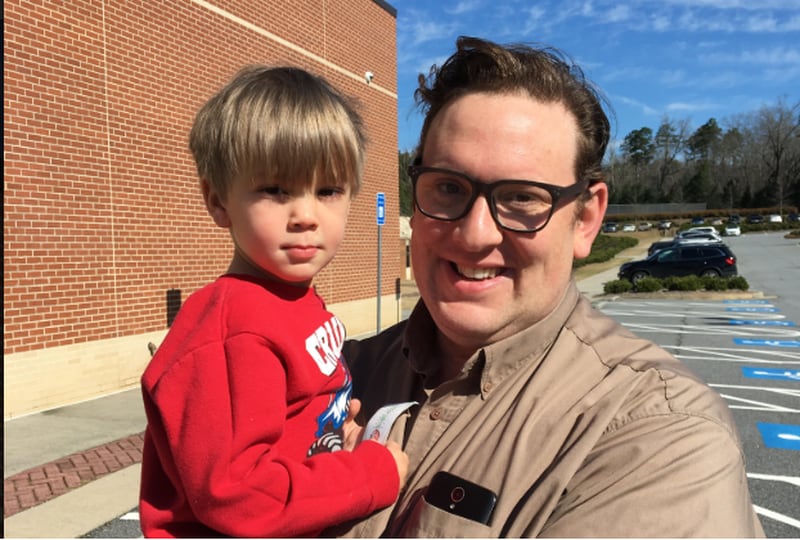 Jonathan Hoover, 38, (right) voted yes on the Gwinnett County MARTA referendum.