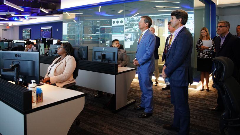 Gov. Brian Kemp tours Equifax’s new “Global Fusion Center” with Equifax CEO Mark Begor. Elijah Nouvelage for The Atlanta Journal Constitution