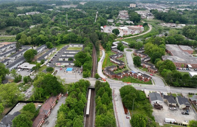 An aerial photograph shows Joseph E. Boone Boulevard NW (left to right), where the MARTA train tracks (top to bottom) cross underneath, on Wednesday, April 24, 2024. (Hyosub Shin / AJC)