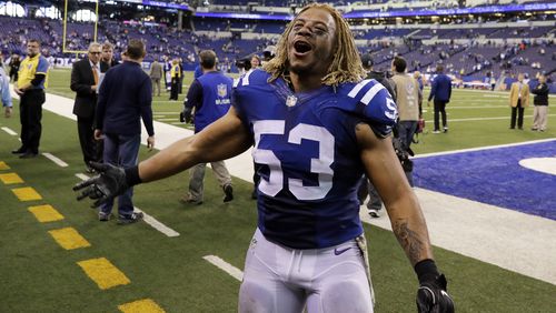Indianapolis Colts linebacker Edwin Jackson (53) walks off the field following an NFL football game against the Tennessee Titans in Indianapolis. Jackson, 26, was one of two men killed when a suspected drunken driver struck them as they stood outside their car along a highway in Indianapolis. The Colts said in a statement  that the team is "heartbroken" by Jackson's death. Authorities say the driver that struck them before dawn on Sunday tried to flee on foot but was quickly captured.  (AP Photo/Darron Cummings, File)