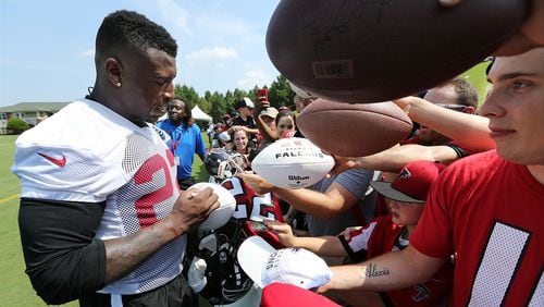 July 27, 2017 Flowery Branch: Falcons safety Keanu Neal signs autographs for fans the first day of team practice at training camp on Thursday, July 27, 2017, in Flowery Branch. Curtis Compton/ccompton@ajc.com