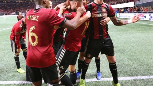 Nov 25, 2018 Atlanta: Atlanta United players mob Hector Villaiba after his goal for a 3-0 victory over the New York Red Bulls during the second half in their Eastern Conference finals MLS soccer game on Sunday, Nov. 25, 2018, in Atlanta.   Curtis Compton/ccompton@ajc.com