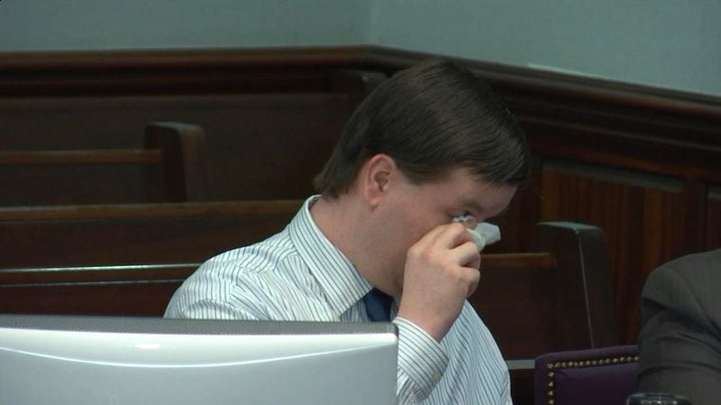 Justin Ross Harris tears up while viewing a photo of Cooper that he had sent his wife days before Cooper's death, during Harris' murder trial at the Glynn County Courthouse in Brunswick, Ga., on Thursday, Oct. 20, 2016. (screen capture via WSB-TV)