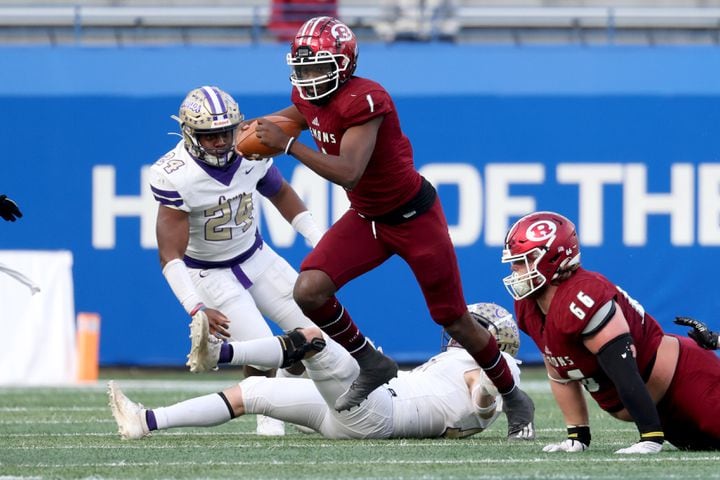 Warner Robins quarterback Jalen Addie (1) rushes for yards in the first half against Cartersville during the first half of their Class 5A state high school football final at Center Parc Stadium Wednesday, December 30, 2020 in Atlanta. JASON GETZ FOR THE ATLANTA JOURNAL-CONSTITUTION