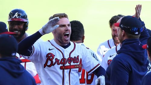Braves win Game 1: Freddie Freeman celebrates his game-winning hit at the end of Wednesday's game against the Reds in the National League Wild Card round. Freeman's 13th-inning single drove in pinch-runner Cristian Pache for the 1-0 win and a 1-0 lead in the best-of-three series. Game 2 will be played Thursday at Truist Park.