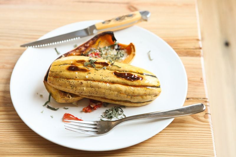 Roasted delicata squash with sage, hot pepper and Tomme cheese. (styling by Chef Angus Brown ) (Photography by Renee Brock/Special)