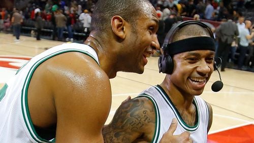 Al Horford (left) of the Boston Celtics reacts with Isaiah Thomas after their 103-101 against the Atlanta Hawks at Philips Arena on January 13, 2017 in Atlanta, Georgia. (Photo by Kevin C. Cox/Getty Images)