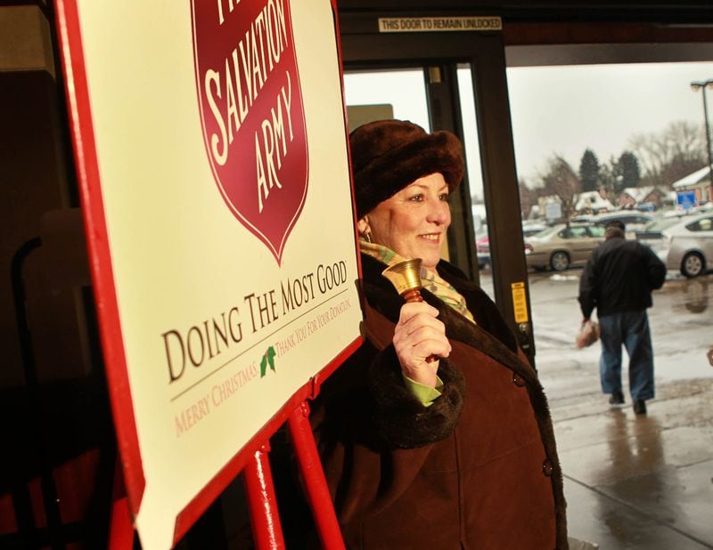 Salvation Army volunteer bell-ringer Linnya Richardson greets shoppers at the Kroger store on Stroop Rd. in Kettering Monday. JIM WITMER / STAFF