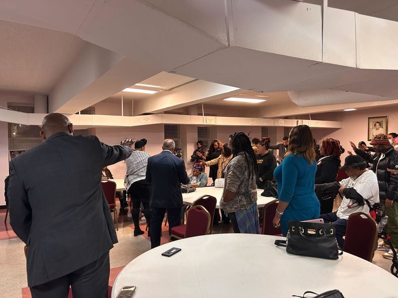 Johnny Hollman's family, community members, church leaders and the family's attorney came together Tuesday evening, less than 24 hours before the release of the body camera footage, for a candlelight prayer vigil at the First Iconium Baptist Church.