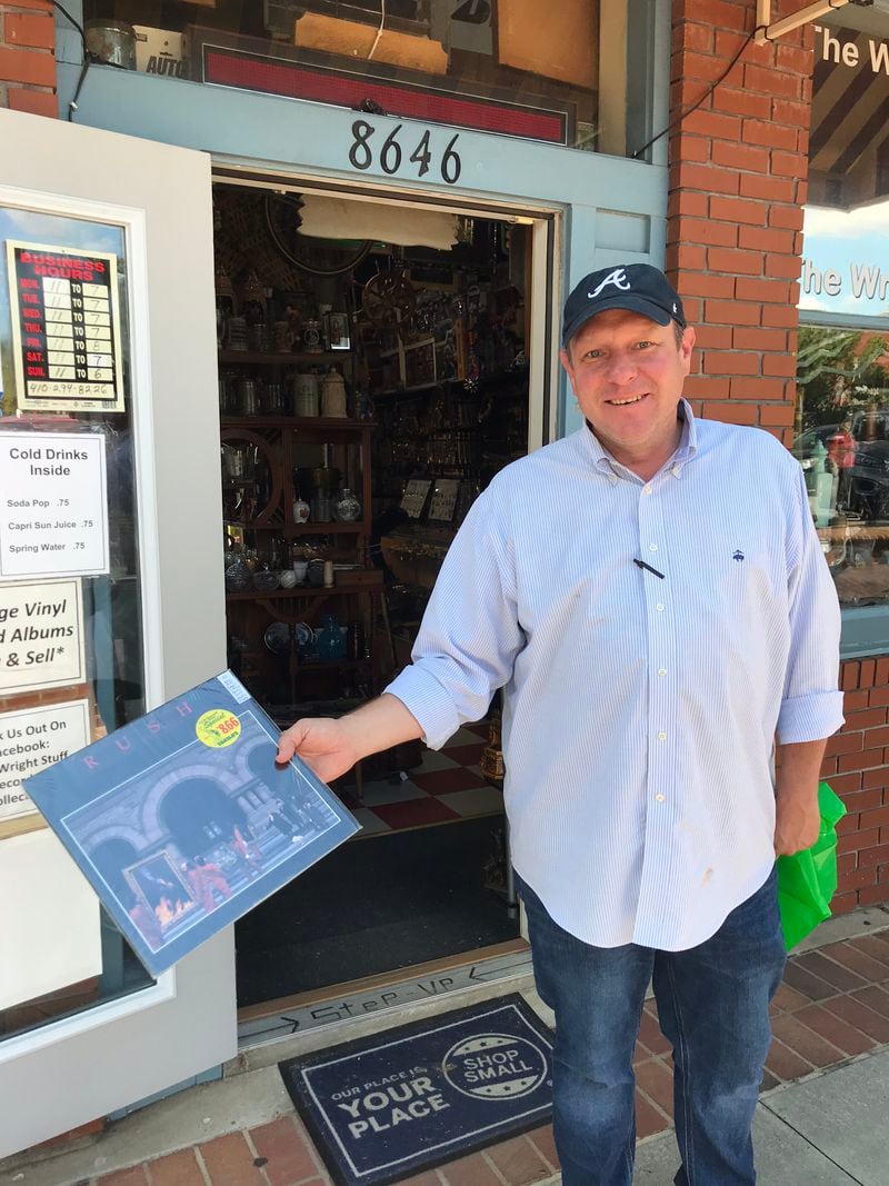 Zach Kell holding his prize: a 1981 master pressing of Rush's "Moving Pictures," which he purchased for $40 from the Wright Stuff Records & Collectibles in Woodstock on October 4, 2018. CREDIT: Rodney Ho/rho@ajc.com