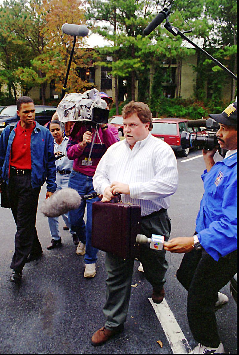 Former Olympic bombing suspect Richard Jewell is questioned by the media as he returns to his Atlanta apartment on Saturday, Oct. 26, 1996. Jewell received, through his attorney Jack Martin, a letter today from the U.S. Department of Justice that officially declared that he is no longer a suspect in the Centennial Olympic Park bombing that occured on July 27, 1996. (AP Photo/Alan Mothner)