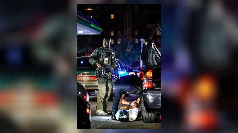 Atlanta police detain a man while breaking up a recent gathering of street racers.