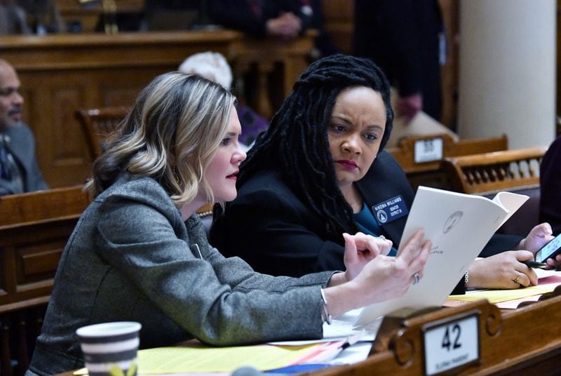 State Sens. Elena Parent (left) and Nikema Williams confer during this year's General Assembly session. The state Democratic Party's executive committee tapped Williams on Monday to take the place of U.S. Rep. John Lewis on the November ballot following his death Friday. (Hyosub Shin / Hyosub.Shin@ajc.com)