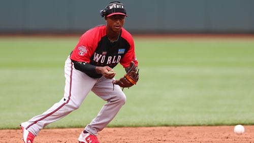 CINCINNATI, OH - JULY 12: Ozhaino Albies #7 of the World Team fields a ground ball during batting practice before the SiriusXM All-Star Futures Game at the Great American Ball Park on July 12, 2015 in Cincinnati, Ohio. (Photo by Elsa/Getty Images)