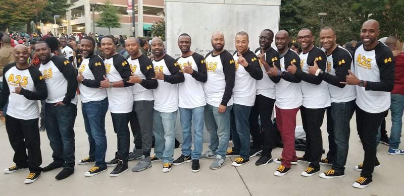 Stephen Chester, 43, a 2001 graduate of Morehouse College (fourth from right) poses with his fraternity brothers during homecoming events in 2018. CONTRIBUTED