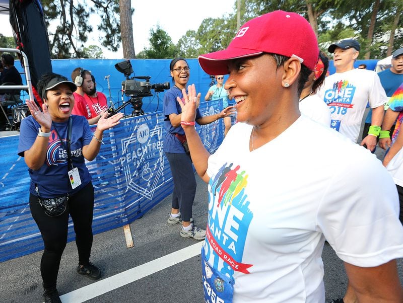 Atlanta Mayor Keisha Lance Bottoms is cheered as she finishes the AJC Peachtree Road Race on Wednesday, July 4, 2018, in Atlanta. Curtis Compton/ccompton@ajc.com