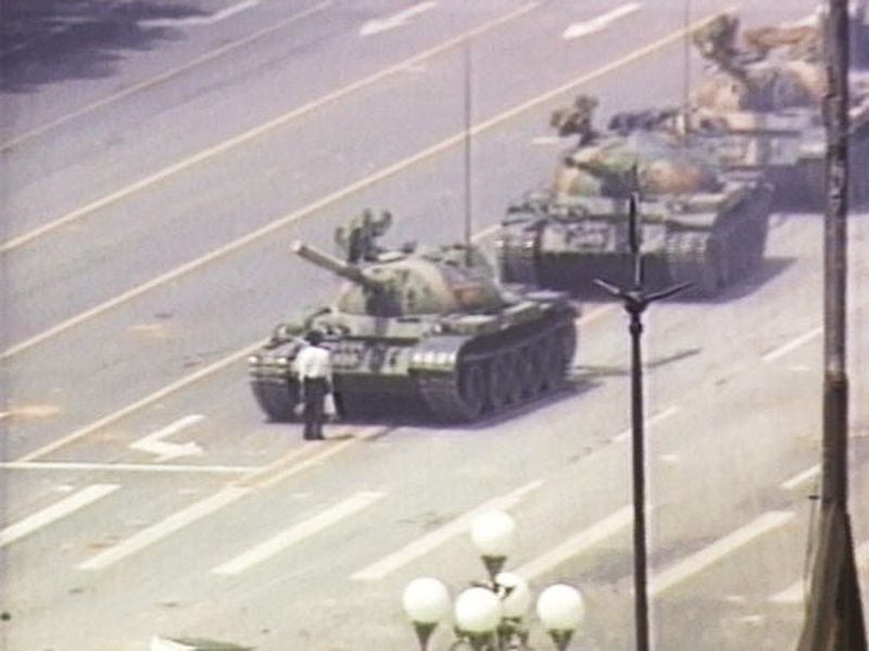  A lone demonstrator stands down a column of tanks June 5, 1989, at the entrance to Tiananmen Square in Beijing. 