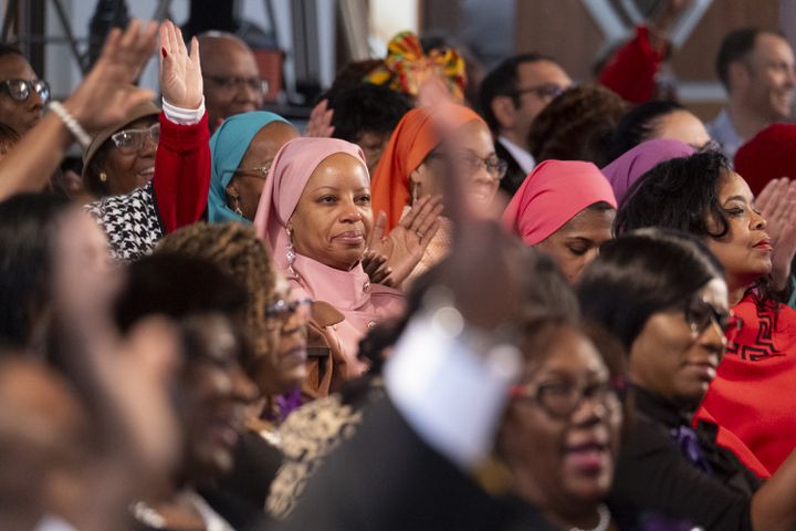 The audience reacts as Karen Briggs plays “Lift Every Voice and Sing” on violin during the Dr. Martin Luther King Jr. Day program at Ebenezer Baptist Church in Atlanta on Monday, Jan. 15, 2024.   (Ben Gray / Ben@BenGray.com)