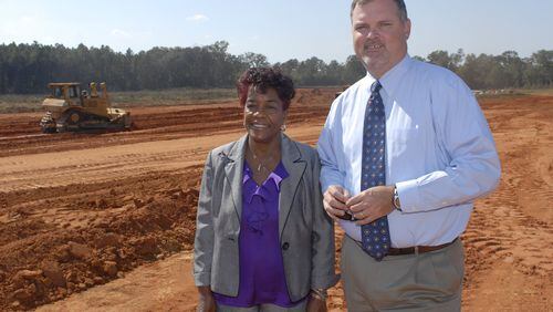 Albany Mayor Dorothy Hubbard, left, and Albany-Dougherty Economic Development Commission President Ted Clem stand at a new industrial park on the city’s outskirts. City leaders hope a $30 million fund they ve created to recruit businesses to move to Albany will usher in economic renewal.