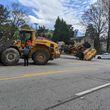 A Gwinnett County police officer used a local waste management company's front-end loader to disable another front-end loader driven by a disgruntled employee who led officers on a chase along public roads near Duluth on Saturday.