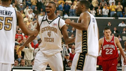 Georgia Tech's Chris Bosh (4) celebrates with teammates Anthony McHenry (55) and B.J. Elder (1) after a second-half play, with Maryland's Nik Caner-Medley (22) looking on, Sunday, Feb. 9, 2003, at the Alexander Memorial Coliseum in Atlanta. Georgia Tech won 90-84.  (Photo/Gregory Smith)