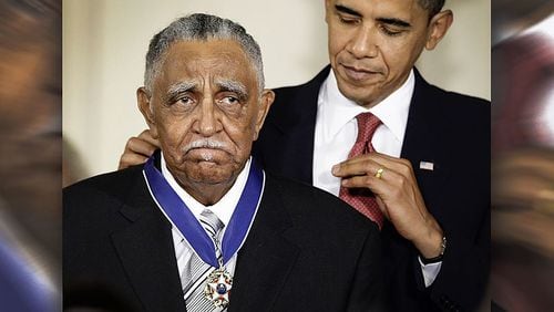President Barack Obama places the Presidential Medal of Freedom around the neck of the Rev . Joseph E. Lowery. Lowery was an early supporter of Obama’s 2008 presidential bid and would deliver the benediction at his 2009 inauguration.
