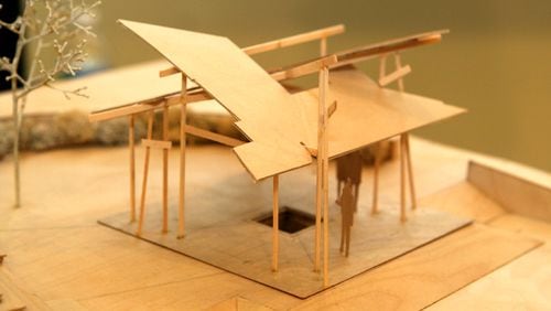 An architect’s model depicts the multi-roofed structure that would mark the site of the natural spring that gave Sandy Springs its name.