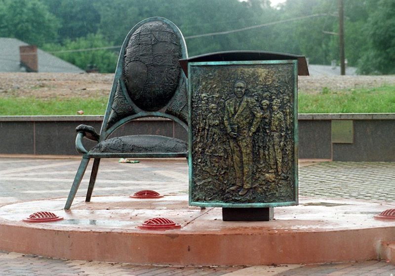 A memorial to Ralph David Abernathy includes a chair and lectern bearing a relief portrait of him, items suggestive of the civil rights leader's role in the struggle for racial justice. It was part of a larger installation created by the late Atlanta born artist, Emma Amos as part of a public art program for the 1996 Olympics. (AJC Staff Photo/Frank Niemeir) 6/96
