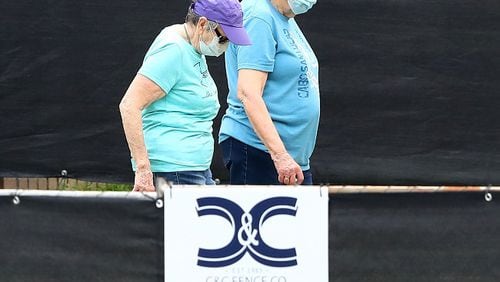 March 12, 2020 Marietta: A pair of women in a housing area at Dobbins Air Reserve Base on Thursday, March 12, 2020, in Marietta.   Curtis Compton ccompton@ajc.com