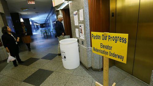 In the Fulton County Government Center, portable heaters sit in the atrium, and signs inform of renovations that are in progress, including the elevators. Fulton County spent nearly half a million dollars to assess its facilities. Some renovations are in progress. (BOB ANDRES / BANDRES@AJC.COM AJC File Photo)