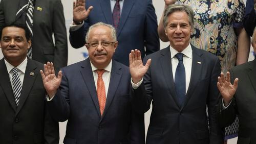 Guatemalan Foreign Minister Carlos Ramiro Martinez Alvarado, left, and U.S. Secretary of State Antony Blinken pose for a group photo at the National Palace in Guatemala City, Tuesday, May 7, 2024. Blinken is in Guatemala for a two-day visit where he will attend a regional meeting on irregular migration. (AP Photo/Moises Castillo)