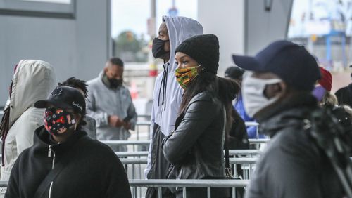 Voters came to State Farm Arena on Monday, Dec. 14, 2020 to cast their votes to determine which political party controls the U.S. Senate on the first day of early voting. Both of Georgia’s Senate seats were up for grabs. (John Spink / John.Spink@ajc.com)