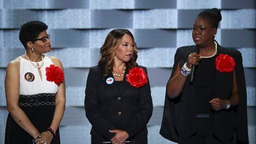 Lucy McBath, center, stands with Geneva Reed-Veal (left) and Sybrina Fulton, the mother of Trayvon Martin,  on day two of the Democratic National Convention in Philadelphia on July 26, 2016. The so-called Mothers of the Movement, who all lost children in violent confrontations with police, vouched for Clinton.  (Eric Thayer/The New York Times)
