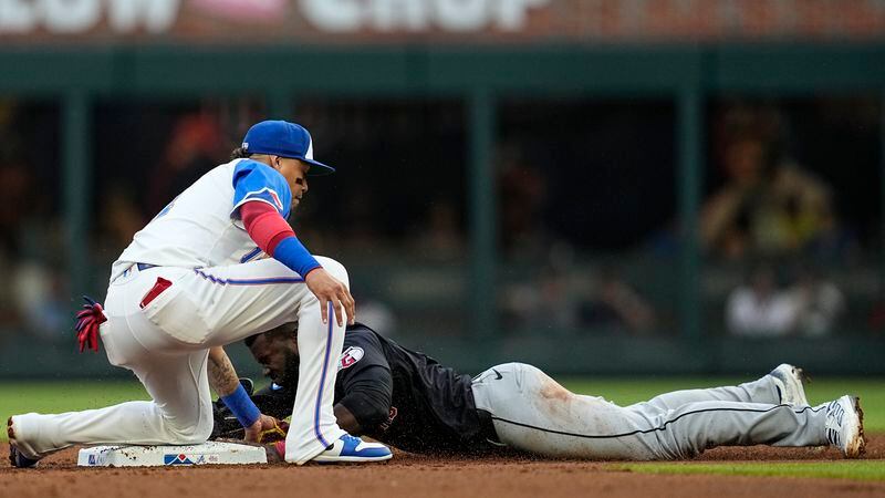 Atlanta Braves shortstop Orlando Arcia (11) tags out Cleveland Guardians outfielder Estevan Florial (90) in the second inning of a baseball game, Saturday, April 27, 2024, in Atlanta. (AP Photo/Mike Stewart)