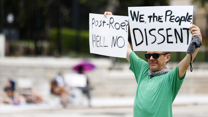 Jack Walsh from Decatur shows support to abortion rights as protests continue Sunday, July 3, 2022,  outside the state Capitol in Atlanta. "I have two daughters, and when they grow, they will have the right to choose," Walsh said. (Photo: Miguel Martinez / Miguel.martinezjimenez@ajc.com)