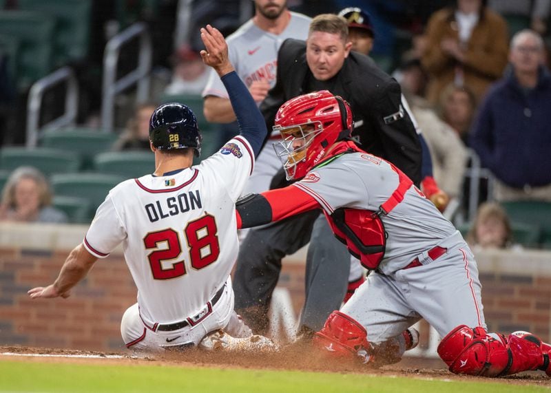 Atlanta Braves first baseman Matt Olson (28) is thrown out at the plate to end the seventh inning during the game with the Cincinnati Reds at Truist Park Saturday, April 9, 2022 (Steve Schaefer / steve.schaefer@ajc.com)
