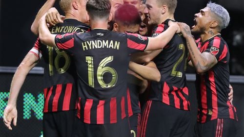 August 14, 2019 Atlanta: Atlanta United captain Jeff Larentowicz (far left) is mobbed by teammates after scoring a goal to tie the game 2-2 with Club America in the Campeones Cup on Wednesday, August 14, 2019, in Atlanta.   Curtis Compton/ccompton@ajc.com