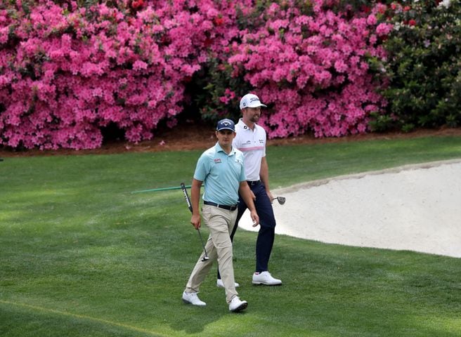 April 8, 2021, Augusta: Webb Simpson, left, and Christiaan Bezuidenhout walk up to the thirteenth green during the first round of the Masters at Augusta National Golf Club on Thursday, April 8, 2021, in Augusta. Curtis Compton/ccompton@ajc.com