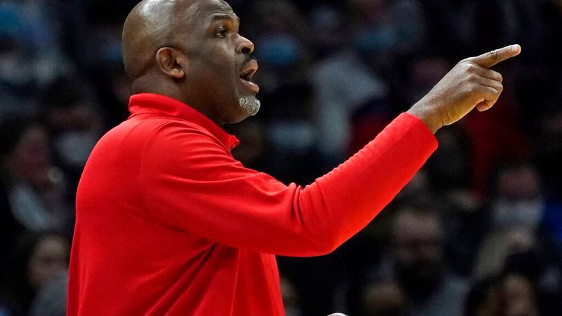 Atlanta Hawks coach Nate McMillan gives instructions to players during the second half of the team's NBA basketball game against the Cleveland Cavaliers, Friday, Dec. 31, 2021, in Cleveland. (AP Photo/Tony Dejak)