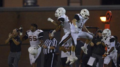 Kell junior FS Nicholas Ross (left) and junior WR Sam Blancato (right) react to a turnover in the second half of their game at East Paulding Friday, September 29, 2017. Special/Daniel Varnado